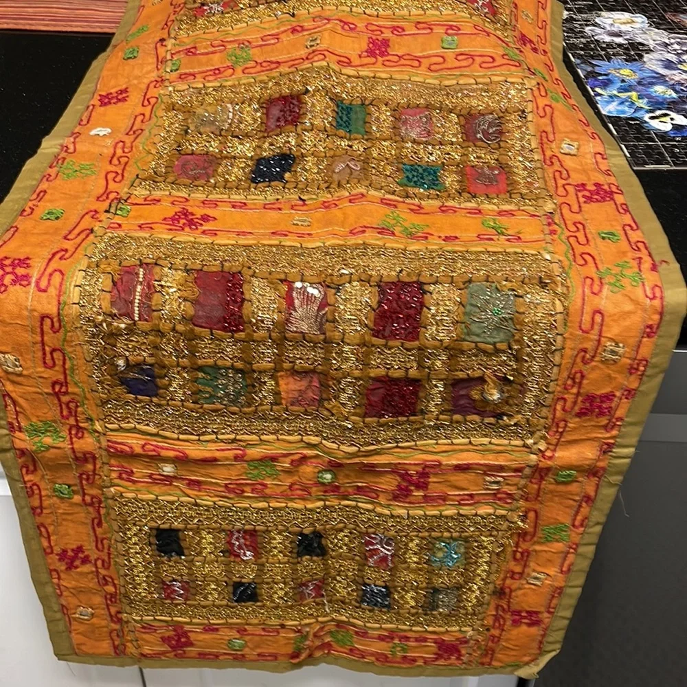 Table runner. 58 in length. Width 22 inches
